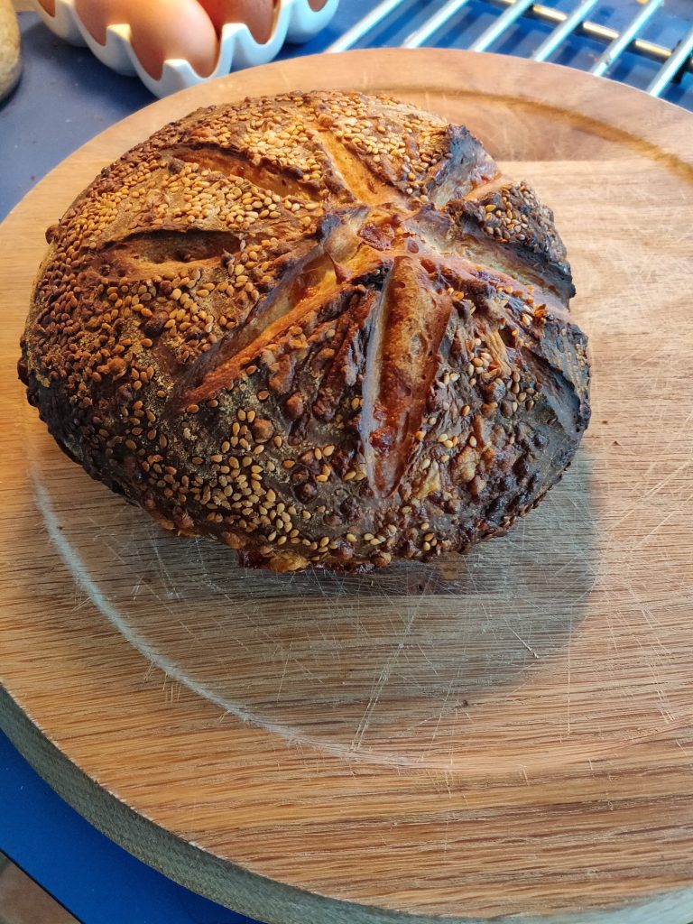 A finished sesame sourdough loaf