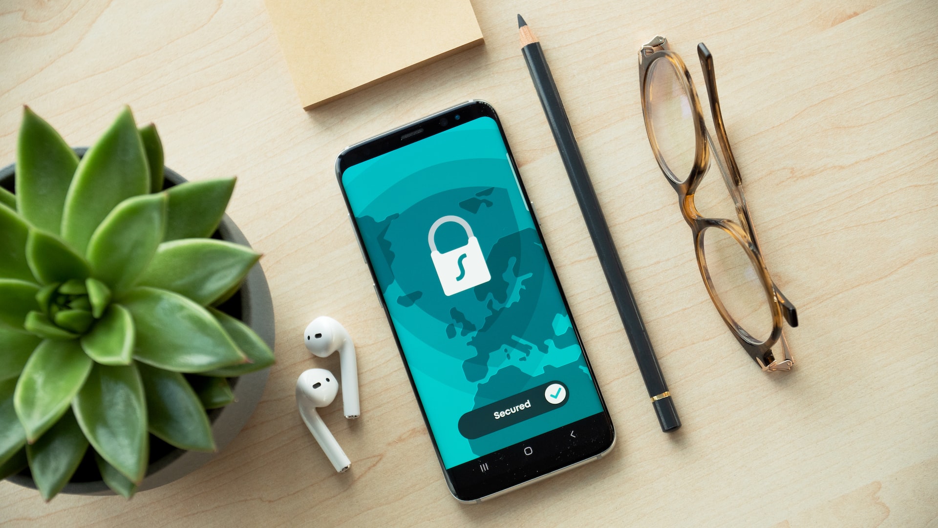 image of a phone with a padlock on screen and other items.